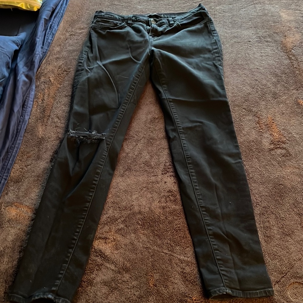 J Brand stretch black skinny leg jeans with hole in knee Size 30